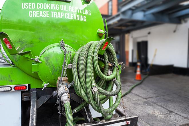 industrial pump clearing a grease trap in Cherry Hill